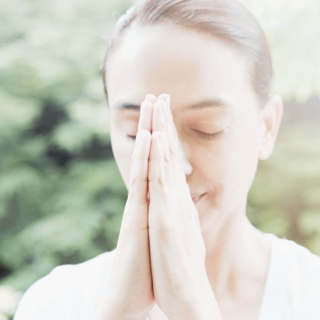 balance meditation woman with hands at heart