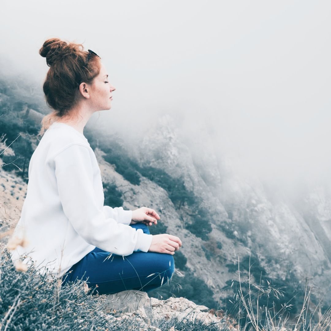 Releasing meditation woman with hands at heart