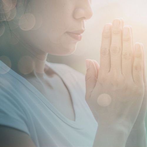 Sundays woman with prayer hands