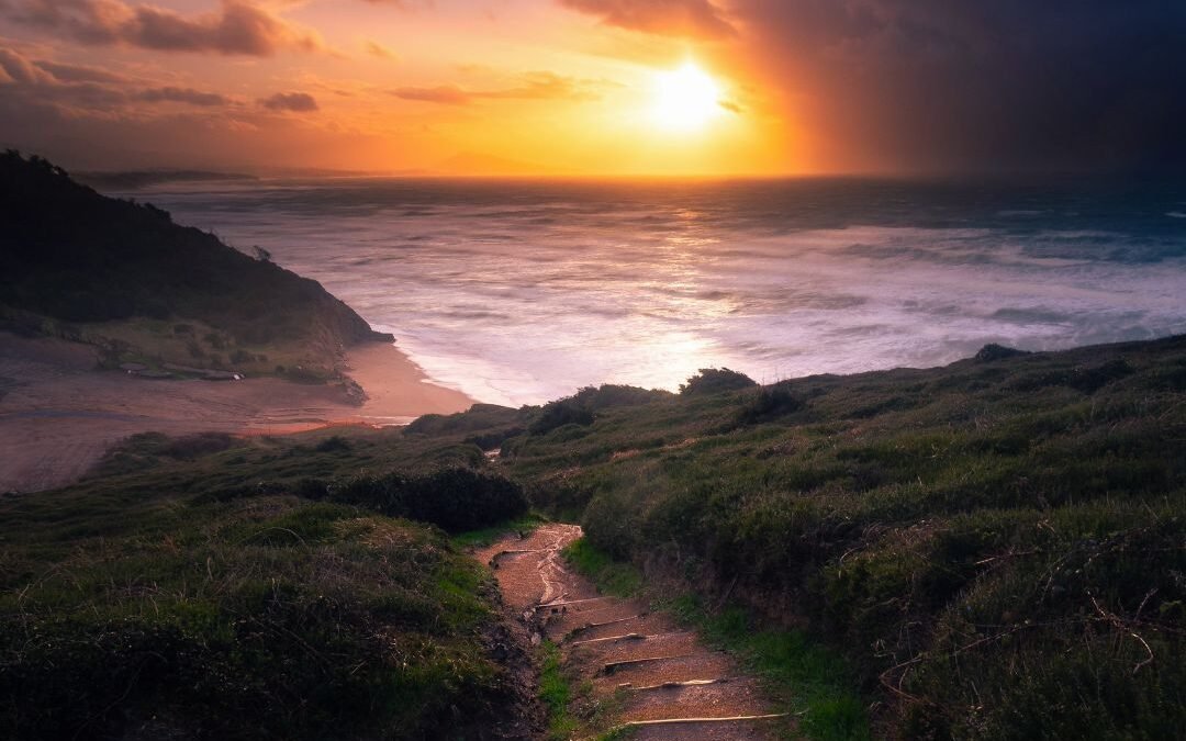 sun through storm clouds